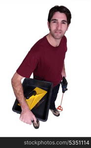 Man carrying pain mixing equipment