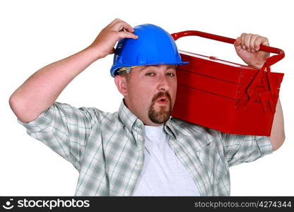 Man carrying tool box on shoulders