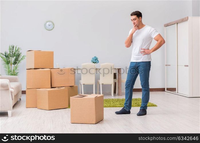 Man caryying boxes at home