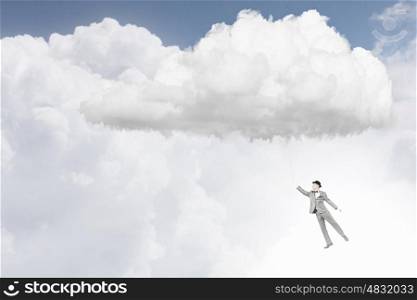 Man catch cloud. Young businessman caught white cloud with rope