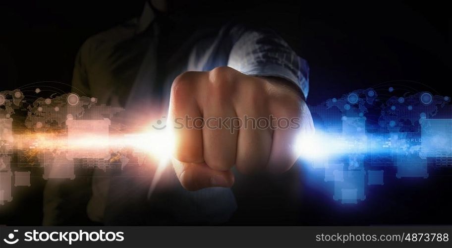 Man catch stream of light. Close up of businessman grasping light in fist