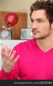 Man catching apple