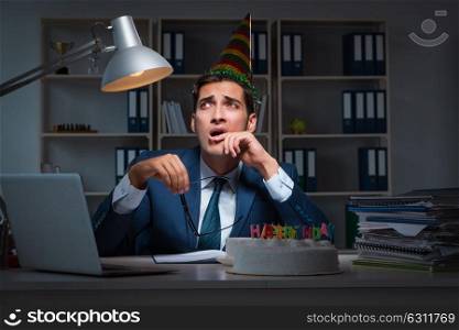 Man celebrating birthday in the office. The man celebrating birthday in the office