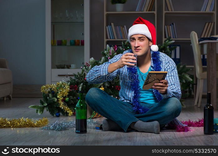 Man celebrating christmas at home alone