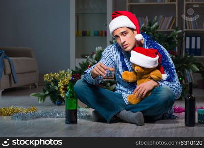 Man celebrating christmas at home alone