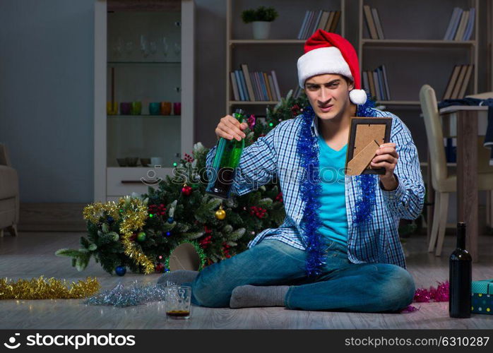 Man celebrating christmas at home alone