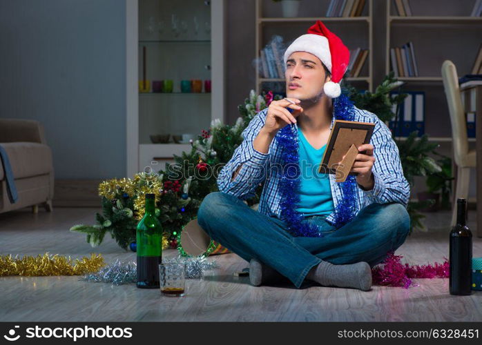 Man celebrating christmas at home alone. The man celebrating christmas at home alone