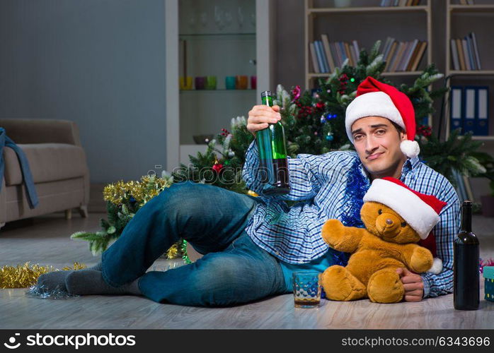 Man celebrating christmas at home alone. The man celebrating christmas at home alone