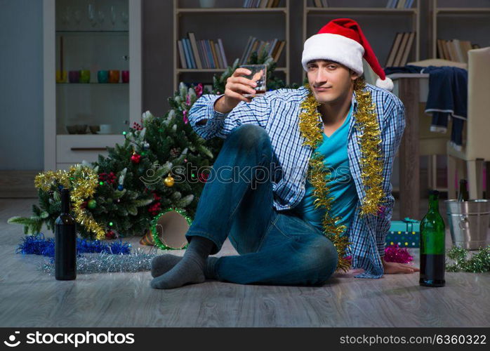 Man celebrating christmas at home alone. The man celebrating christmas at home alone