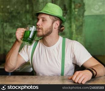 man celebrating st patrick s day with drink