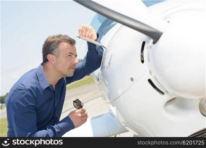 Man checking aircraft