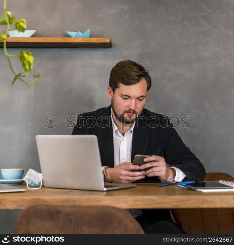 man checking his phone work