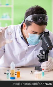 Man chemist working in the lab