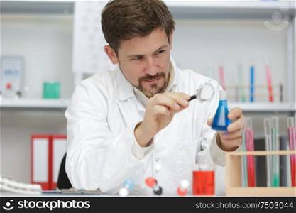man chemist working in the lab