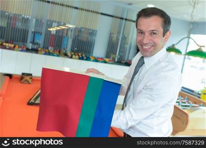 man choosing a color from the sampler