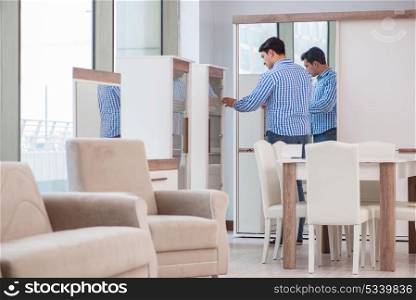 Man choosing furniture in the shop