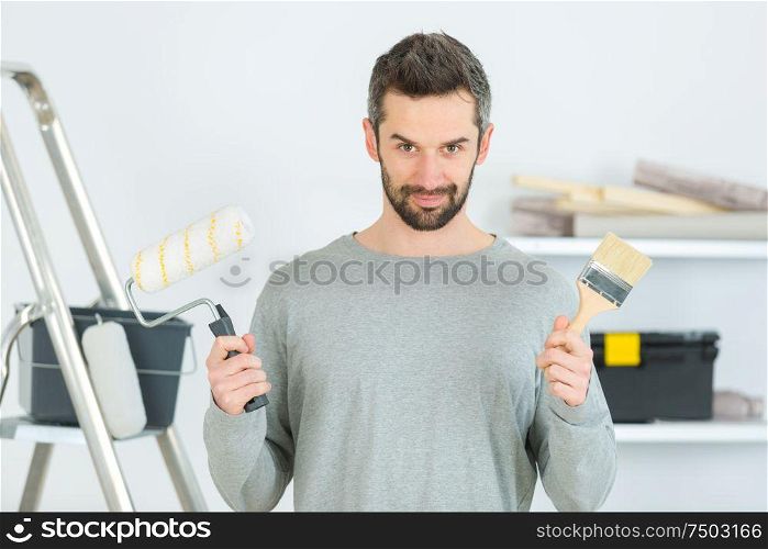 man choosing what tool to use