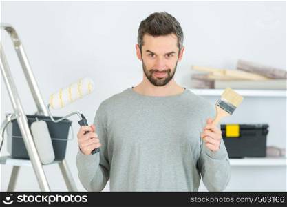 man choosing what tool to use