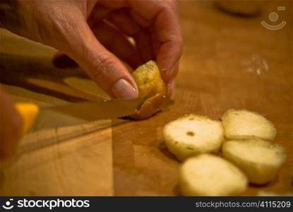 Man chopping potatoes