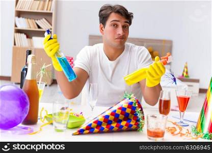 Man cleaning the house after christmas party