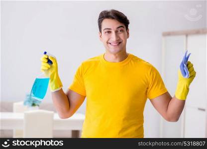 Man cleaning the house helping his wife