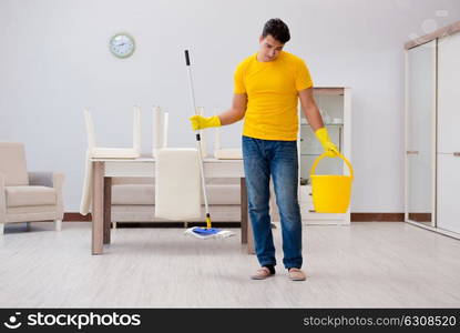 Man cleaning the house helping his wife