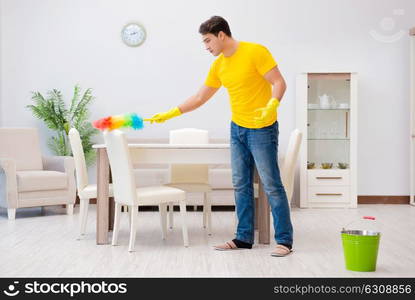 Man cleaning the house helping his wife