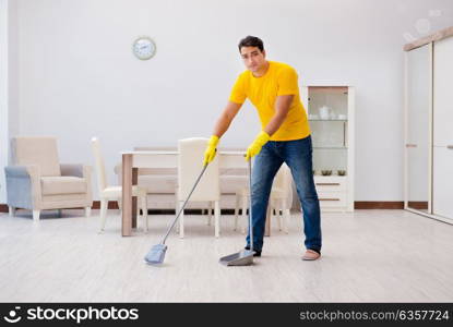 Man cleaning the house helping his wife