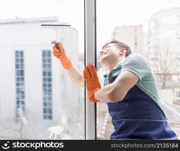 man cleaning windows