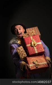 Man clown carrying a lot of Christmas gifts