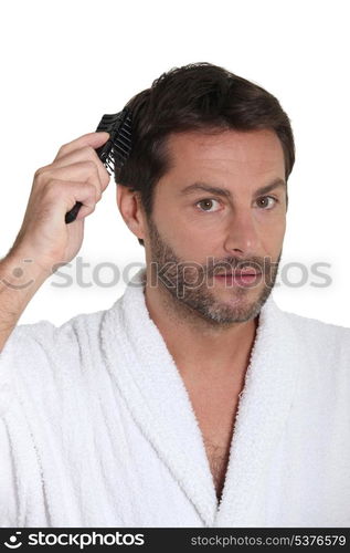 Man combing hair