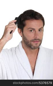 Man combing hair