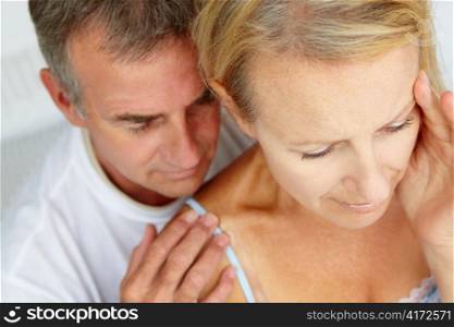 Man comforting distressed wife