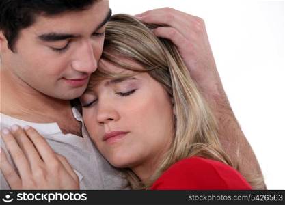Man comforting girlfriend