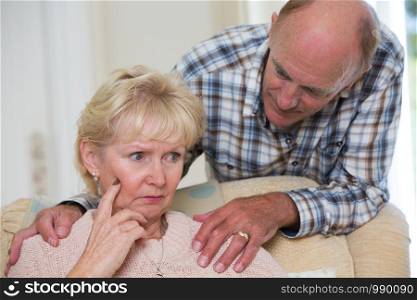 Man Comforting Senior Woman With Depression