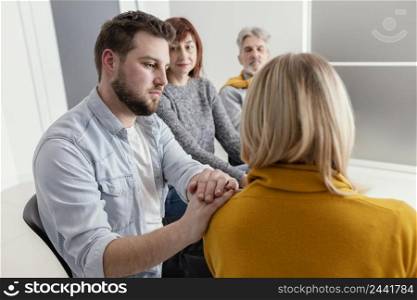 man comforting woman therapy 2
