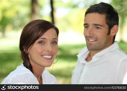 Man contemplating brown-haired woman