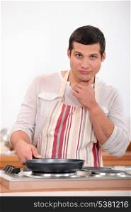 Man cooking alone on kitchen