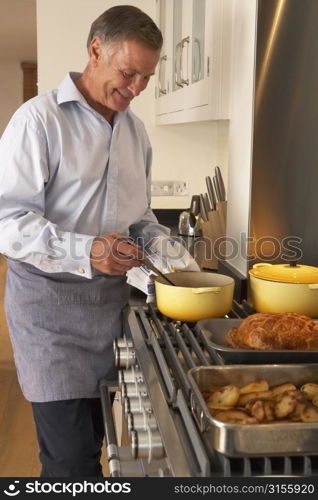 Man Cooking At Home