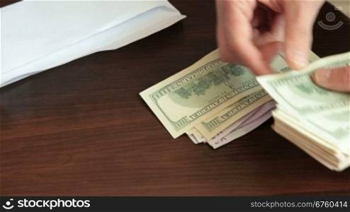 Man counting and giving cash money another man