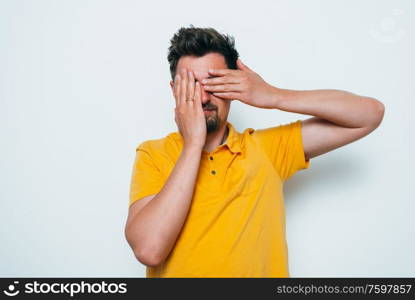 man covered his face with his hands