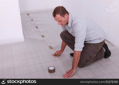 Man covering floor