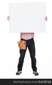 Man covering his face with a blank sign