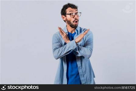 Man crossing arms in rejection, a man crossing his arms with rejection expression, concept of man rejecting