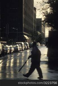 Man Crossing City Street