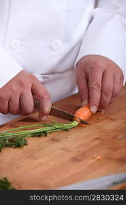 Man cutting carrots