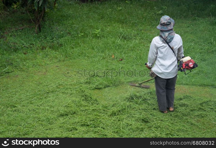 man cutting grass with a lawn mower&#xA;