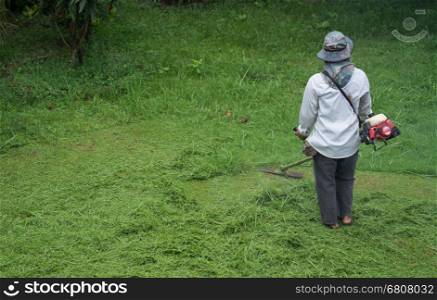 man cutting grass with a lawn mower&#xA;