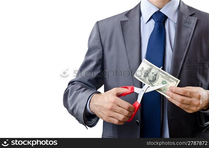 Man cutting money on white