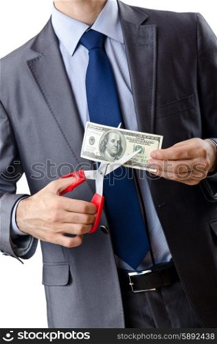 Man cutting money on white